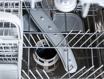 How do you unclog a dishwasher spray arm